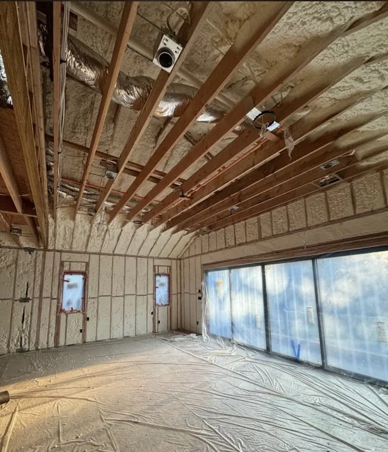 Interior walls and ceiling insulated with spray foam during new construction in Hebron